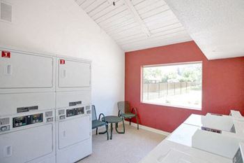 apartment with amenities including laundry facility